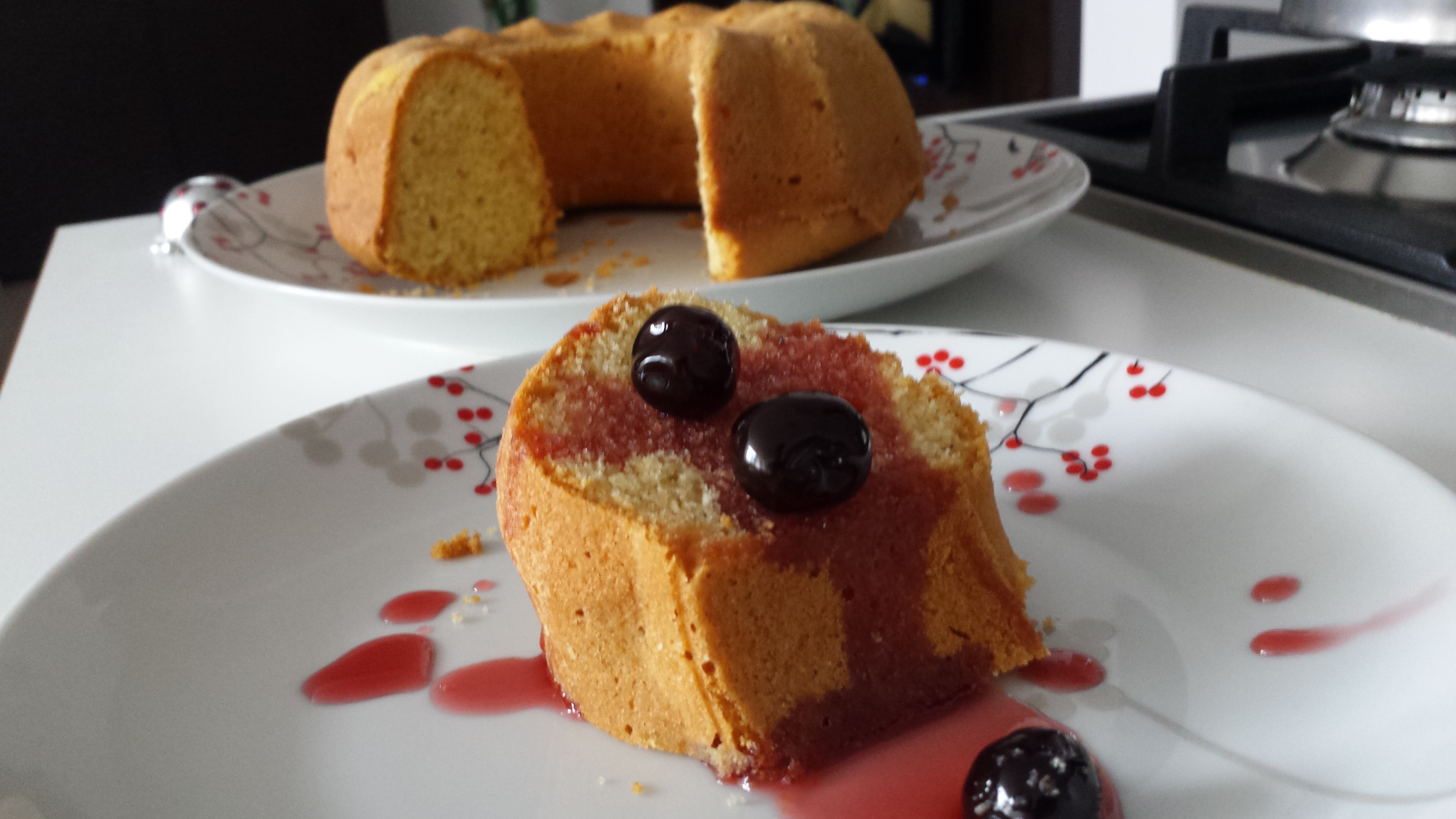 corn and spelt flour cake with black cherry syrup